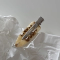 Macro detail of French marble acetate hair clip with resin dots and metal crocodile grip - Apricot Coffee Row Rhinestone