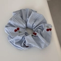 Detail view of blue striped scrunchie with red cherry embroidery and pastoral style texture - Blue Striped - Cherry