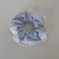 Detail of light blue hair scrunchie with delicate white floral lace trim and pleated fabric - Blue Series - Seersucker Small Scrunchie