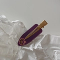 Close-up of purple acetate hair clip with gold metal duckbill clip and moon star patterns - Purple Moon