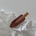 Detailed macro view of French acetate hair clip with marble pattern and small rhinestone stars - Korean Pink Moon