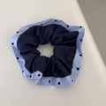 Detailed shot of navy blue scrunchie with striped edges and black heart pattern - Blue Series - Heart Polka Dot Navy