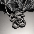 Close-up of vintage stainless steel Ouroboros snake pendant with Celtic knot details - Steel Color Pendant Only (Without Chain)