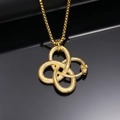 Macro detail of golden Ouroboros snake pendant with intricate scale texture and Celtic knot shape - Gold Pendant Only (Without Chain)