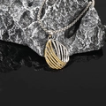 Macro detail of Bohemian twisted teardrop pendant with yellow zircons on box chain - Yellow Zirconia Pendant Only (Without Chain)