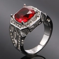 Macro detail of luxury four-prong red gemstone ring with side pave diamonds and hollow pattern - Size 7 / Steel Red Ruby