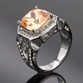 Macro detail of champagne cushion-cut gem with intricate geometric hollow band design - Size 7 / Steel Color Champagne Gemstone