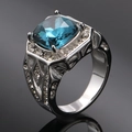 Macro shot of square-cut blue gemstone ring with detailed side hollow patterns - Size 7 / Steel Color Dark Blue Zirconia