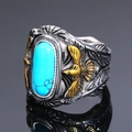 Anillo de águila vintage de acero de titanio con turquesa ovalada en primer plano - US 7 / Oro y Plata