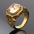 Detail view of champagne cushion-cut stone with gold geometric hollow patterns on ring - Size 7 / Gold Champagne Gem