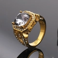 Detail view of gold ring with cushion-cut clear stone and intricate side engraving - Size 7 / Gold Mineral Black