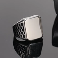 Macro shot of silver men's signet ring with honeycomb cutout texture and flat rectangular face - US 7 / Oil Rubbed Steel