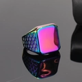 Macro shot of rainbow gradient square ring with honeycomb cut-out details on black mirror - Rainbow