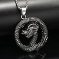 Macro close-up of intricate dragon carving on a vintage stainless steel round pendant - Pendant Only (No Chain) / Steel