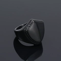 Macro shot of black matte shield ring with braided rope texture and reflective finish - US 7 / Black