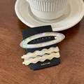 Detail of 3-piece oval and wavy acetate hair clips with opal texture on card - Set of 3 / Rainbow