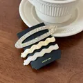 Three-piece acetate hair clip set with oval marble and wave designs on wood surface - Set of 3 / Jade Color