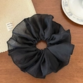 Close-up of oversized black lace organza scrunchie on a rustic wooden table setup - Black