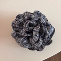 Detailed macro view of British plaid fabric layers on a rose-shaped shark hair clip - British Plaid Claw - Navy Blue