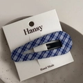 Detail of blue and white plaid fabric snap hair clip on a minimalist ceramic plate - Blue Plaid Snap Clip