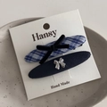 Detailed set of blue plaid bow hair clip and navy matte clip on display card - Navy Blue Plaid Oval Pair Clips