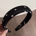 Detail of black floral satin scrunchie headband showing brand label and fabric texture - Black Print Padded Headband