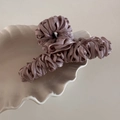 Macro shot of large purple silk ribbon hair claw with elegant pleated fabric texture - Dust Rose