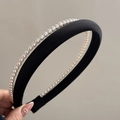 Detail of elegant black satin headband with double-layered white pearls for women - Black