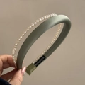 Detail of double-layered green satin headband with white pearls and handmade label - Green