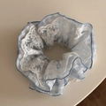 Close-up of blue plaid scrunchie featuring elegant double-layer white floral lace details - Blue