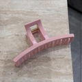 Detailed macro view of the glossy pink rectangular hair claw clip with golden metal spring - Hollow Rectangular Style (Nenfen Chunse Zhua - Loukong Yizi)