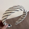 Detail showing knit lace scrunchie with classic black stripes and red heart patterns - Headband / Red Heart Black Stripe - Headband