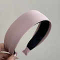 Detail of pink ribbed knit headband featuring French minimalist fabric texture and non-slip lining - Pink