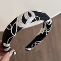 Close-up of elegant black hair scrunchie with white floral embroidery texture - Neo-Chinese Embroidery Black Headband