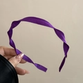 Detailed view of dark purple ribbed fabric headband with elegant spiral texture - Dark Purple