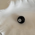Detail view of mini acetate billiard ball number 8 hair claw clip on a white plate - Round Style (FJ891721) / Style 8 (Black)