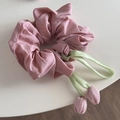 Close-up of pink scrunchie with light green satin ribbons and tulip fabric flower charms - Pink