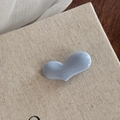 Detail of light blue heart-shaped resin accessory with a glossy polished ceramic-like finish - Light Blue Solid Heart Clip