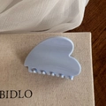 Close-up of light blue heart-shaped hair claw clip with glossy finish and smooth teeth - Light Blue Solid Heart Shaped Claw