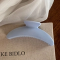 Detail of light blue hair claw clip with smooth glossy finish and non-slip inner teeth - Light Blue Solid Crescent Claw