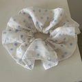Detailed view of white large polka dot scrunchie with blue and yellow spots texture - Crinkled Blue Polka Dot