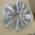 Detail of blue and white checkered scrunchie with soft fabric texture and pleated design - Light Blue Grid