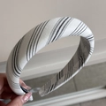 Close-up of minimalist black and white striped fabric headband with premium texture - Letter Patch Headband-White