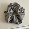Macro shot of gray plaid scrunchie hair tie showing detailed cotton fabric texture - Scrunchie / Khaki
