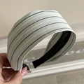 Detailed macro view of mint green striped cotton fabric and black inner frame on the headband - Fresh Striped Green Wide Headband