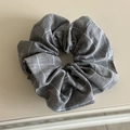 Close-up detail of grey checkered scrunchie with soft cotton blend fabric texture - Scrunchie / Gray