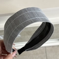 Detail of grey striped fabric hair scrunchie with soft texture and internal non-slip base - Headband / Gray