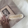 Detail of cream-colored acrylic hair clip featuring colorful rhinestones on a vintage book - Rectangular Style (FJ891659) / Creamy White - Straight Clip