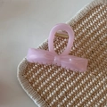 Close-up of translucent pink bow hair claw clip with fine glitter and golden spring - Pink Glitter Jelly - Basic Knot