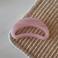 Macro detail of crescent moon hair claw in translucent pink resin with silver spring - Pink Glitter Jelly - Crescent